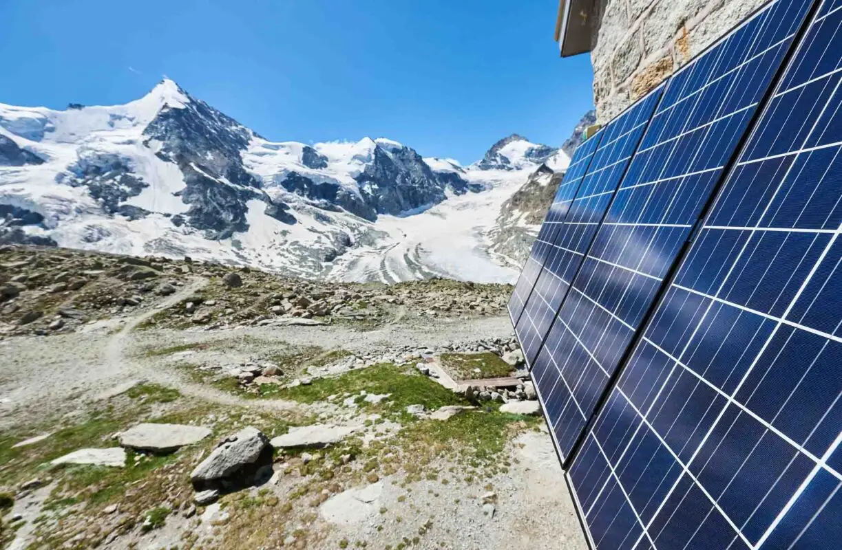 Grand Mountet Hut with solar batteries on the wall on a beautifu