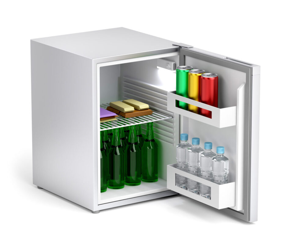 Minibar refrigerator with drinks and snacks