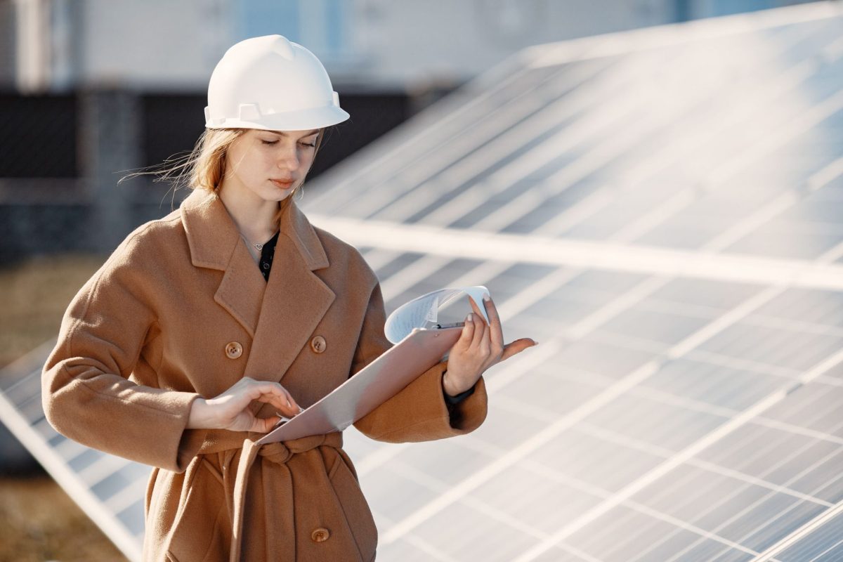young woman with checklist standing at solar plant 2023 11 27 05 33 57 utc