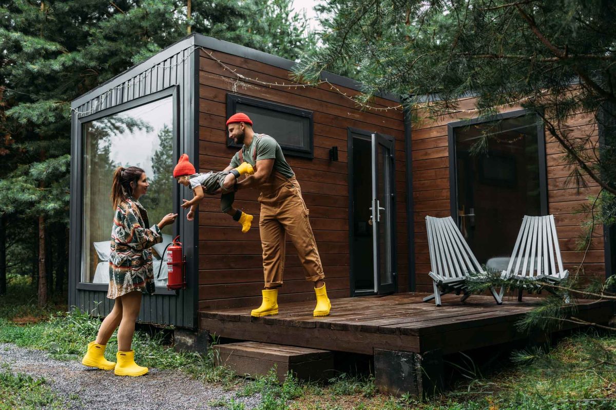 A happy family is having fun in a country house. off-grid living
